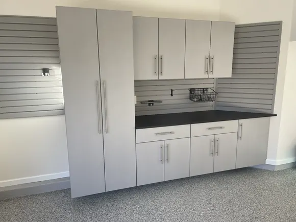 Custom Angled Wall Cabinets In Silver Frost With Gray Slatwall Detail