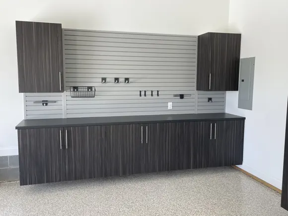 Custom Cabinets In The Color Nightowl With A Gray Slatwall