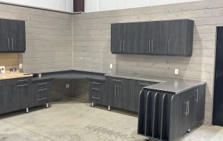 custom garage cabinets upper and lower with custom countertop and gun storage at end